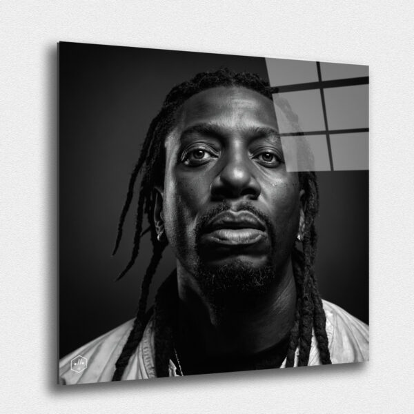 "A hyperrealistic black-and-white portrait of Ol' Dirty Bastard in the distinctive Studio Harcourt style. ""Legends Never Die: Timeless Portraits of Fallen Hip-Hop Icons in Harcourt Elegance"" captures the enduring spirit and cultural impact of the most iconic figures in hip-hop history. This exclusive collection presents each legendary artist in the timeless black-and-white style of Studio Harcourt, blending their powerful presence with classic elegance. The portraits pay tribute to the creativity, resilience, and influence of these fallen icons, immortalizing their legacy with unmatched sophistication. A must-have for collectors and fans alike, this series is a celebration of the enduring power of music, culture, and the voices that continue to inspire generations."