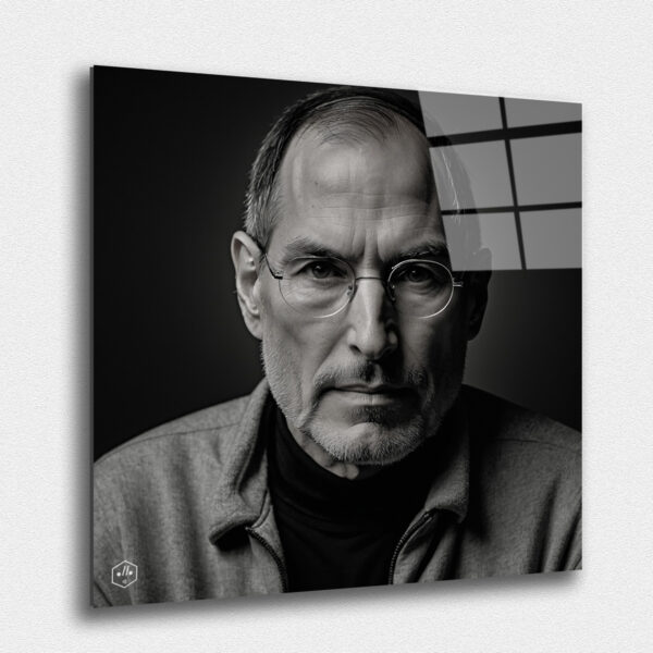 "A thoughtful black-and-white portrait of Steve Jobs, focusing on his intense gaze and contemplative expression."